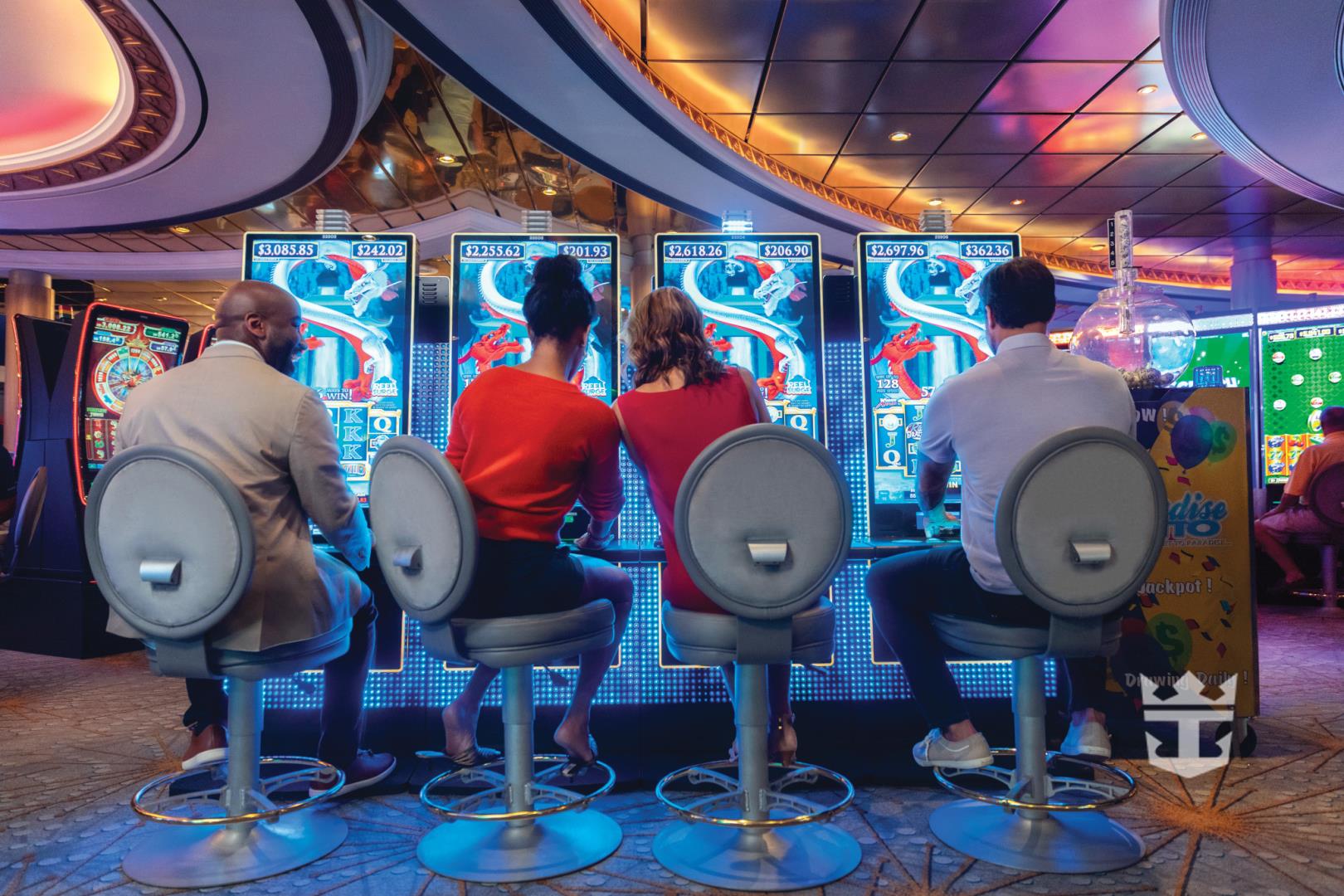View of two couples playing with slot machines in the River Dragon Casino - Photo Credit: F Fernandez